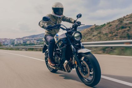 A 2020 Yamaha XSR700 motorcycle rides along a European freeway